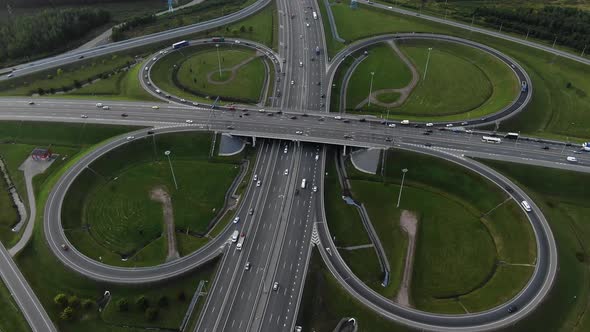 Aerial View of a Multilevel Highway Road with Moving Cars a Butterfly Roundabout From a Bird'seye alt