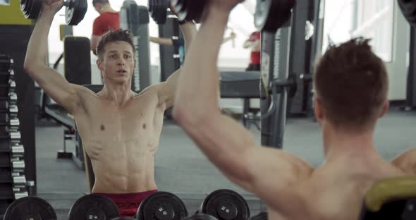 Man Doing Biceps Lifting Barbell