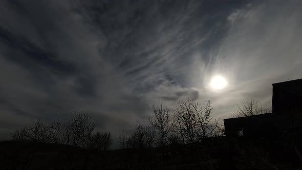 Time lapse: beautiful smoky clouds in sky are covering the sun.