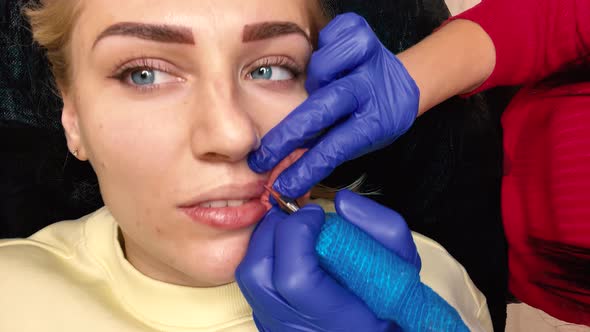 Microblading Lip Tattoo with Special Coloring Pigment That Corrects Lip Color in Cosmetology Clinic