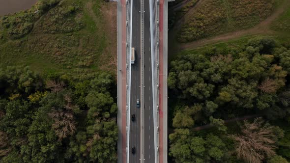 Aerial Birds Eye Overhead Top Down Panning View of Modern Road Bridge Over River alt
