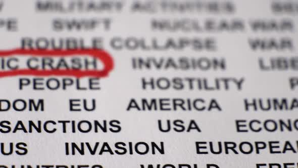 Closeup Shot of ECONOMIC CRASH Written on Paper with a Red Circle Around It