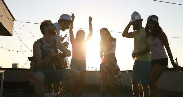 Group of Happy Friends Having Party on Rooftop