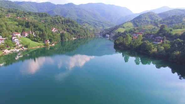 Flying over clear river in Bosnia alt