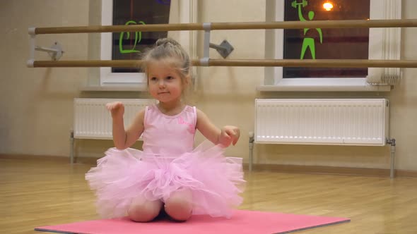 Little Girl Doing Some Ballet Exercises in the Choreography Class