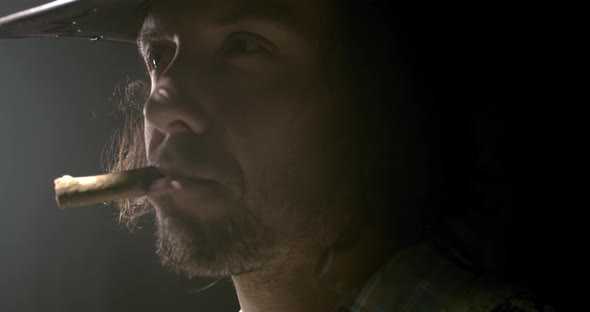 Close up of a masculine american cowboy with a cigar in his mouth, 4k alt