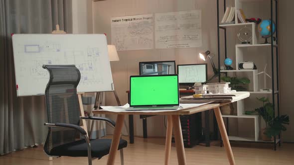 Green Screen Laptop Is On The Table At The Architectural Office alt