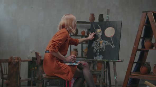 Gifted Female Painter Enjoying Finished Painting alt