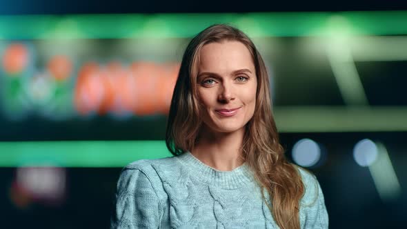 Portrait of Smiling Woman Posing at Night City Neon Bokeh Background alt