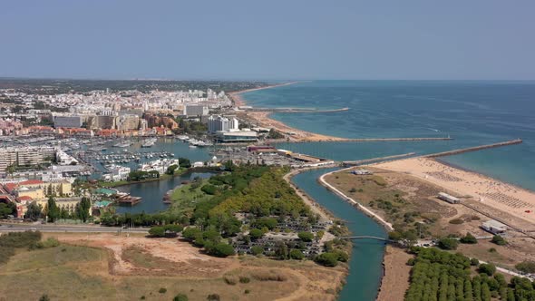 Aerial Video of the Tourist Portuguese Town of Vilamoura with Views of the Beaches and Docks for alt