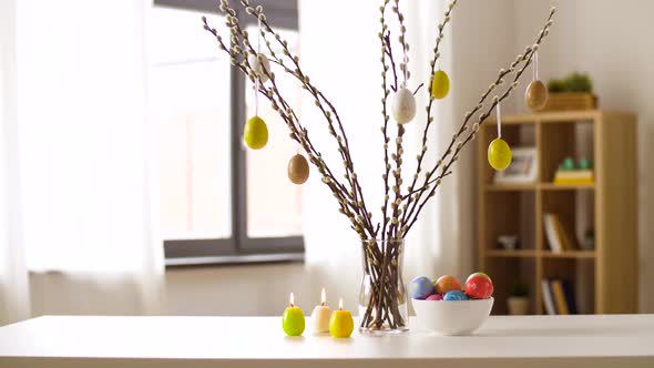 Easter Eggs, Willow and Candles Burning at Home alt
