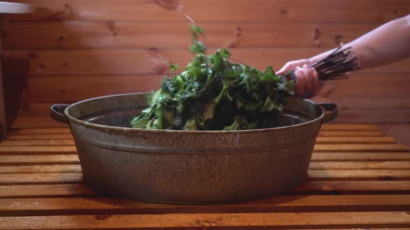 Preparation of a birch broom before visiting the bath. alt