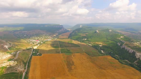 Panorama of Fields and Mountains From a Height