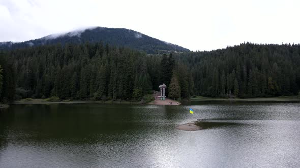 Hikers Landmark Synevyr Lake in Carpathian Mountains alt