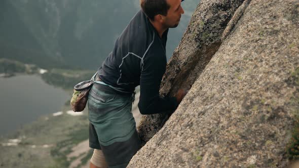 A Brave Young Man Climbs a High Rock