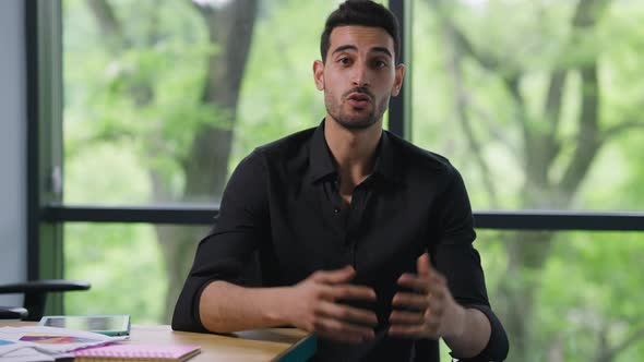 Middle Eastern Businessman Talking Gesturing Conferencing Online on Remote Working alt