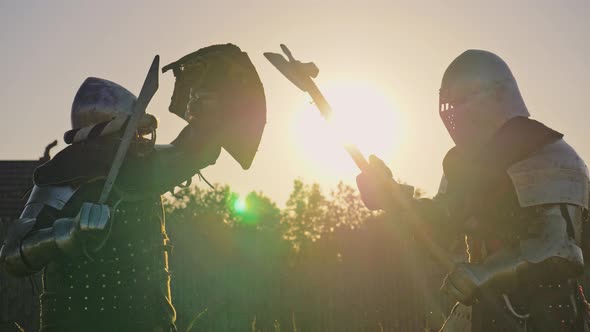 Battle of Two Knights in Armor at Sunset alt