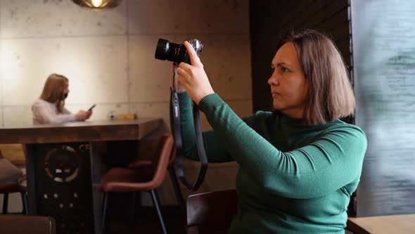 Woman Shoot Video on Photocamera