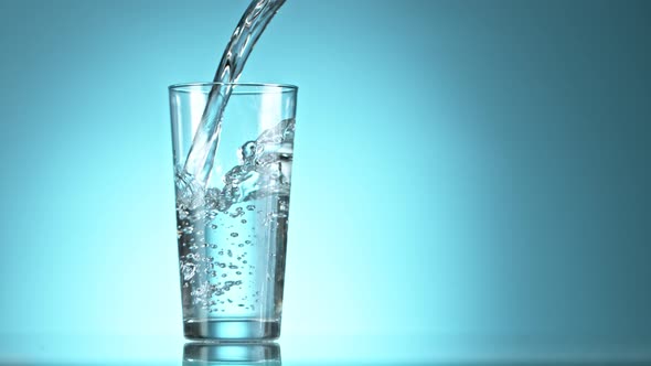 Super Slow Motion Shot of Pouring Fresh Water Into Glass at 1000Fps alt