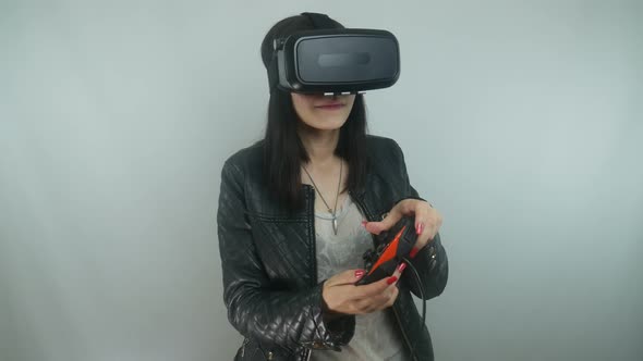 Girl In The Simulation Game Uses A Virtual Reality Helmet And Gamepad