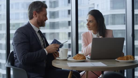 Successful Corporate Team Brainstorming Using Laptop Notepad By Window Office alt