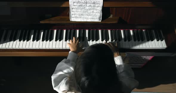 Girl Playing on Piano