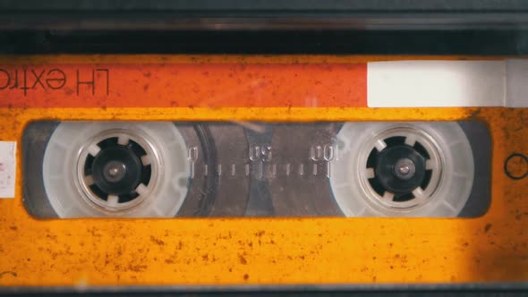 Audio Tape. Vintage Tape Recorder Plays Audio Cassette Inserted Therein alt