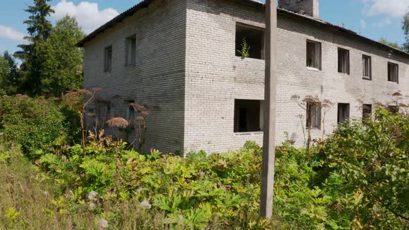 Aerial View of Abandoned and Destroyed Buildings From the Times of the USSR in a Green Picturesque