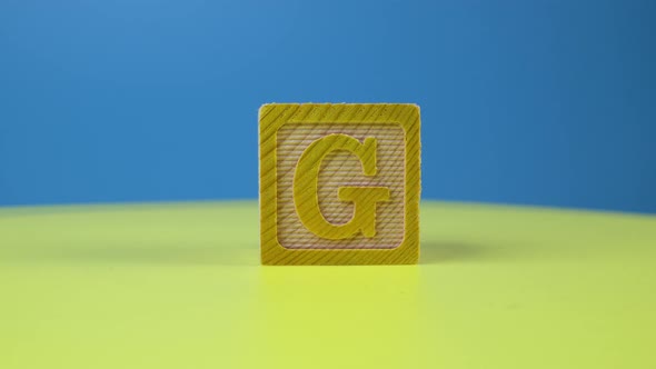 Close up shot letter "G" alphabet wooden block alt