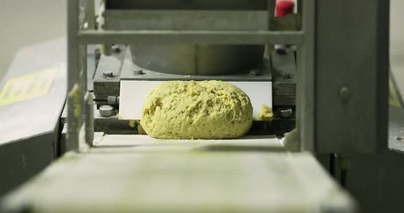 Bread Loaf Dough Divider Machine - Cut Dough On The Moving Conveyor - selective focus alt