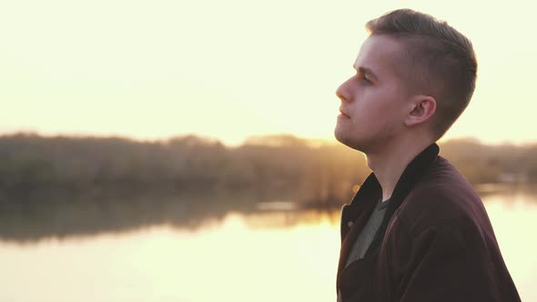 Profile of Pensive Handsome Young Man Enjoying Nature Summer Adventure