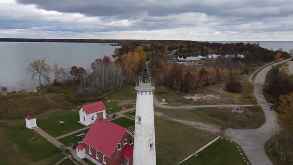 4K drone video Tawas Point Lighthouse in Tawas, Michigan during the fall. alt