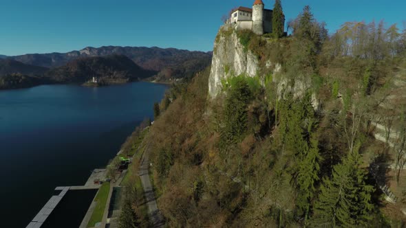 Aerial view of Bled Castle on a lake shore