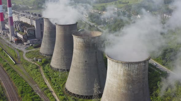 Aerial View of the Pipes of a Coal Power Plant and Cooling Tower alt