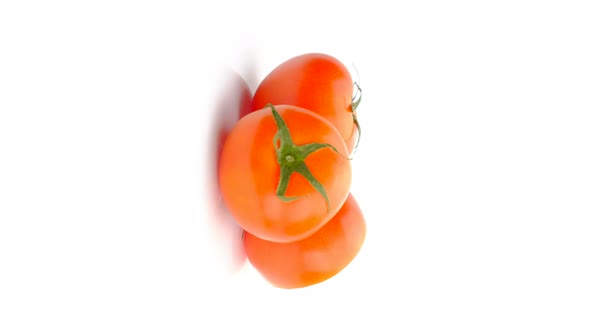 Tomatoes rotation and half tomato rotation isolated on white background