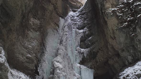beautiful panorama of a frozen waterfall in 4k alt