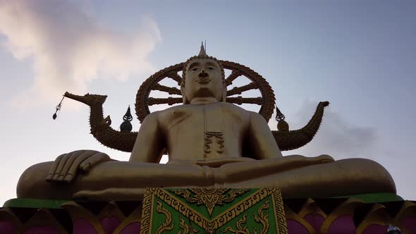 Time lapse of Big Buddha Temple on Ko Samui Thailand. Moving clouds. Buddhism religion. Panning up.