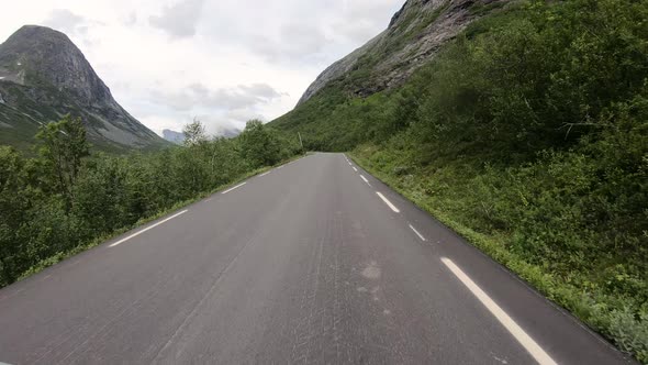 Driving A Car On Serpentine Mountain Road Of Trollstigen In Norway - POV, timelapse alt