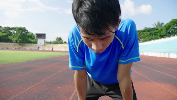 Sportsman Resting After Running At The Stadium alt