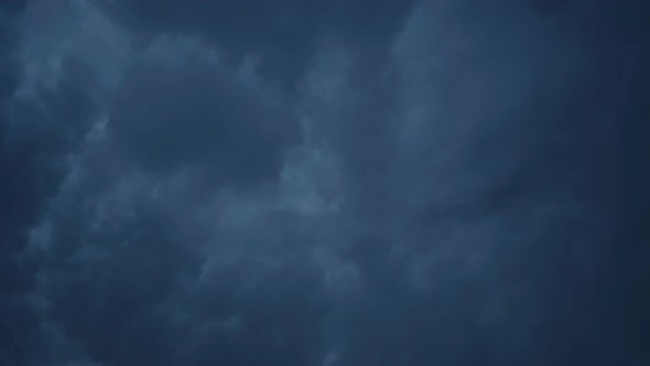 Dark Sky Background. Thunderstorm with Flashing Lightning, Stock Footage
