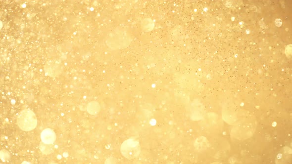 Golden Glitter Background in Super Slow Motion at 1000Fps alt