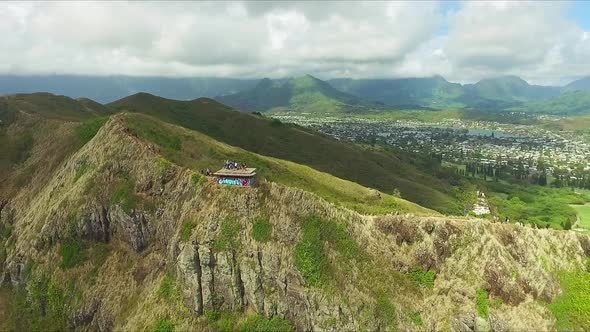 Pullback aerial view of Lanikai pillbox on Oahu Hawaii on a sunny day alt