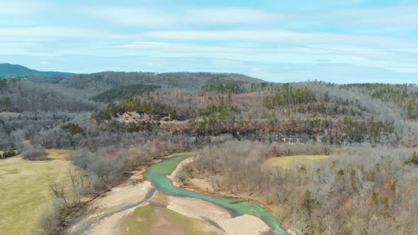 Aerial Of Scenic River Mountains And Road alt