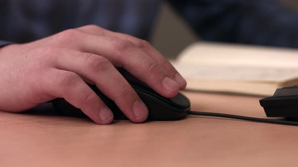 Male Hand On A Computer Mouse