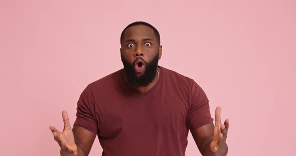 Angry Irritated Young African American Man Isolated on Pink Background alt