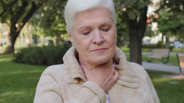 Elderly Aged Woman Unhealthy Lady of Retirement Age Touching Neck Suffering From Angina alt