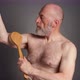 senior man is practicing dry brushing - VideoHive Item for Sale