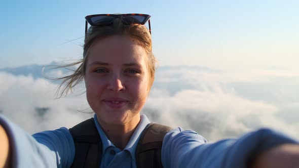 Excited Girl Backpacker in the Mountains Selfie Video alt