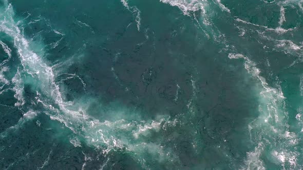 Waves of Water of the River and the Sea Meet Each Other During High Tide and Low Tide. alt