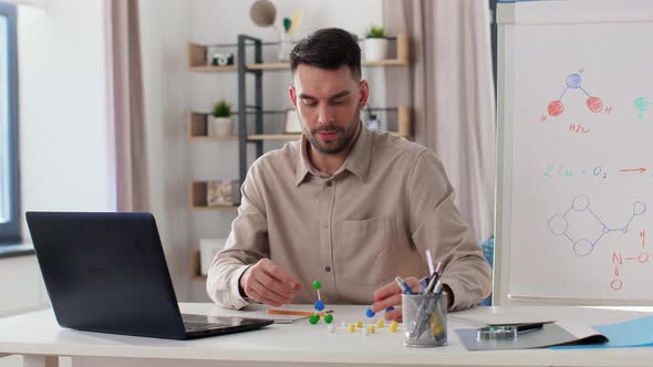 Chemistry Teacher with Laptop Having Online Class alt